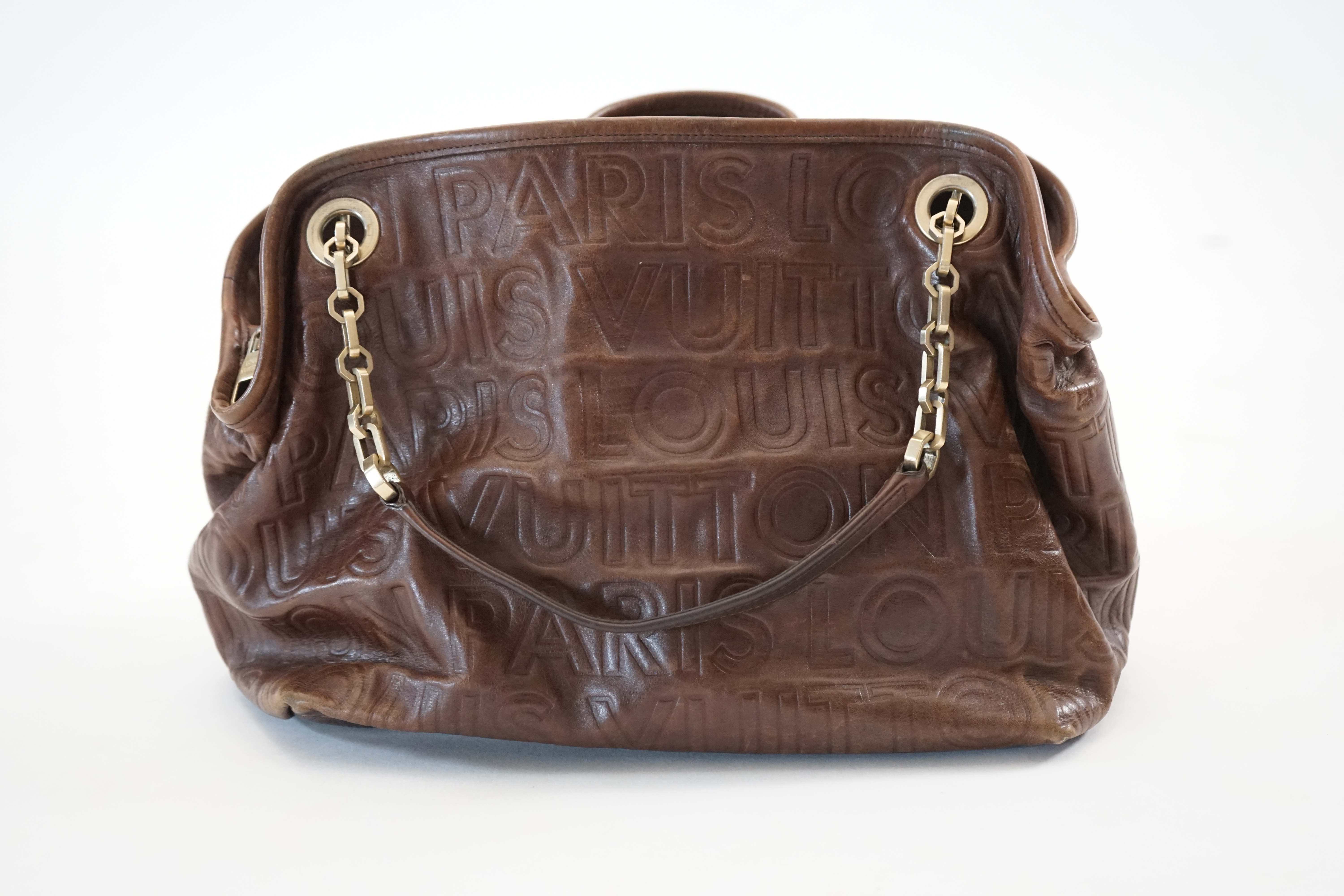A Louis Vuitton Whisper brown leather handbag, width 31cm, depth 22cm, approx height 26cm